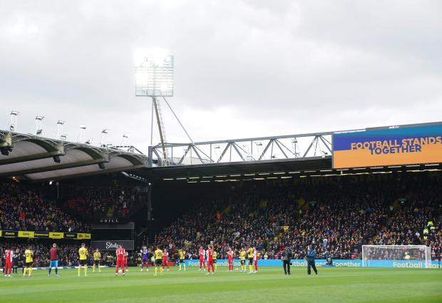 Watford Observer: The players ahead of Watford's game against Arsenal at Vicarage Road in March. Credit: PA