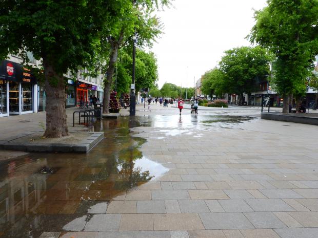 Watford Observer: Puddles of water in The Parade. Credit: Stephen Danzig