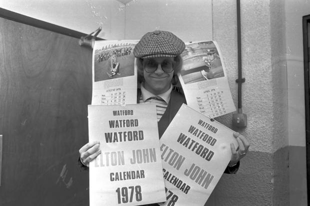 Elton John promoting his calendar in 1977