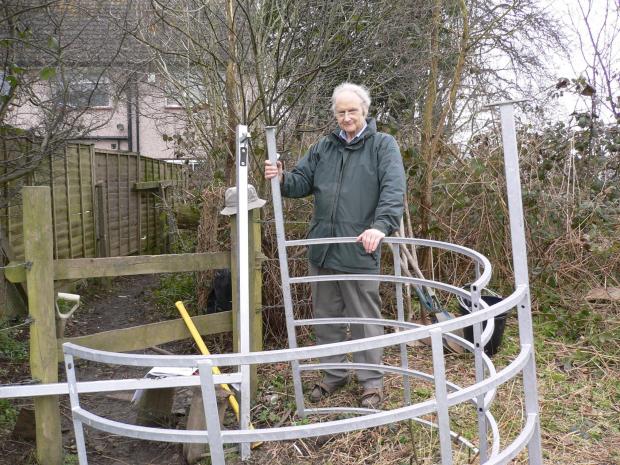 Watford Observer: Chris Beney is starting to replace a stile with a kissing gate near Farm Way, Bushey. Picture: Colin Knight