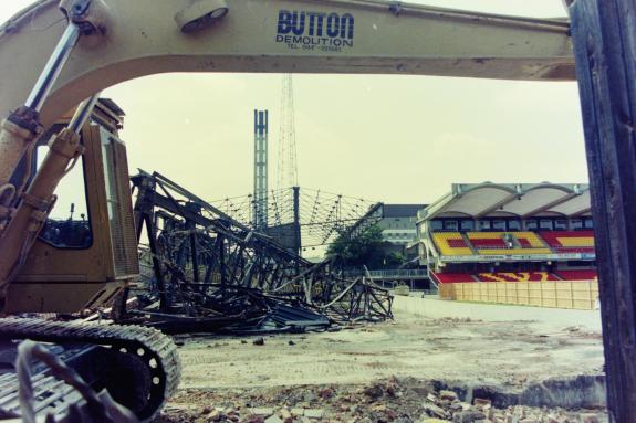 Watford Observer: The arm of this digger frames the mangled roof that used to cover the Rookery Watford Observer: The arm of this digger frames the mangled roof that used to cover the Rookery