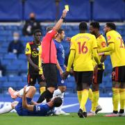 Kevin Friend shows Etienne Capoue a yellow card during Watford's defeat at Stamford Bridge in July 2020. Picture: Action Images