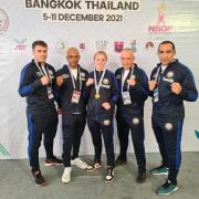 Victorious Ellie Harber, 16, pictured with coaches from the United Kingdom Muay Thai Federation