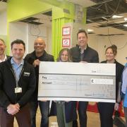 A cheque of £20,000 has been presented to One YMCA Watford with a further £10,000 also being donated. Credit: One YMCA/CAE Technology Services