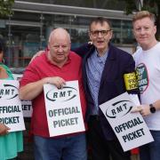 RMT assistant general secretary John Leach (second right) on the picket line at Stratford train station in east London on Friday. Photo: PA