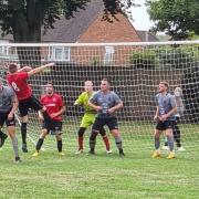 Watford Sports (red shirts) continued their superb form in Division One.