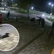 CCTV captures the Tommy silhouette being damaged on the Kingswood estate in Watford on Friday night.