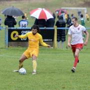 WD Bushey (yellow kit), pictured in action earlier this season, are through to the semi-finals of the Challenge Cup.