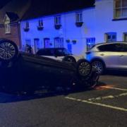 The crash in Bushey High Street left a vehicle on its roof