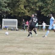 North Watford (black kit) have gone top of the Premier Division. They are pictured in action the previous week