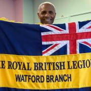 Luther Blissett with the standard for the new Watford branch of the Royal British Legion