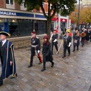 The mace bearer followed by HM Lord Lieutenant Robert Voss CBE then the Royal British Legion Watford standard on the right, on its first historic town parade.