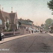 The postcard of Vicarage Road with the cemetery on the left. Image: Watford Museum