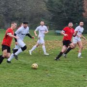 Division One leaders Watford Sports (red shirts) were held to a draw for a second week running