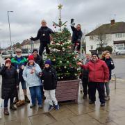 Volunteers decorate Christmas Tree on Goodwood Parade in Courtlands Drive, North Watford