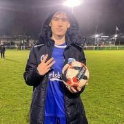 Hat-trick hero Owen Ayres celebrates with the match ball