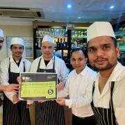 Kings Langley Tandoori owner Janu Miah (middle) thanked his customers for their support.