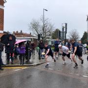 And they're off! Competitors braved the soggy conditions to take part in this year's Ricky Pancake Race