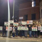 The protesters called on the council to 