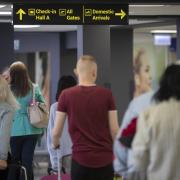 Passengers waiting to get through airport security. Image: PA