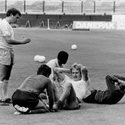 Graham Taylor passes on some instructions as Steve Sherwood does sit ups
