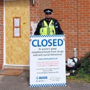 Sergeant Karl Diggins from the Watford Community Safety Unit outside the property.