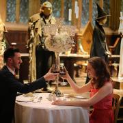 A couple enjoying a romantic dinner in the Great Hal. Credit: Warner Bros. Studio Tour London – The Making of Harry Potter.