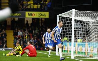 Defeat confirmed: Ben Foster and Kiko Femenia left sat pondering as Adam Webster celebrates Brighton's second goal. Pictures: Action Images