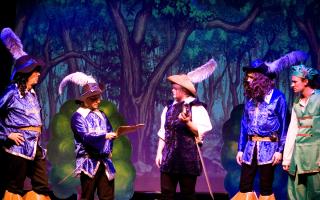 The group performing a previous production of The Three Musketeers.