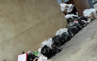 The rubbish piled up outside flats in Salisbury Road, Watford, that is also next to the back of The Cother Arms pub.