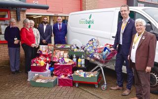 (L-R) Watford Foodbank manager Andrew Tranter, Rotarian Karen Grillo, Carol Grainger, Nitish Soni and Lee Gamble from Berry Recruitment, Mayor Peter Taylor and Cllr Rabi Martins.