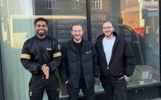 From L to R: Prebz, Mitch and Gavin outside the unit they're renovating for The Daily Grind.