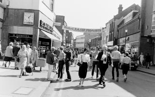 Some shoppers turn round to look at the banner 40 years ago today