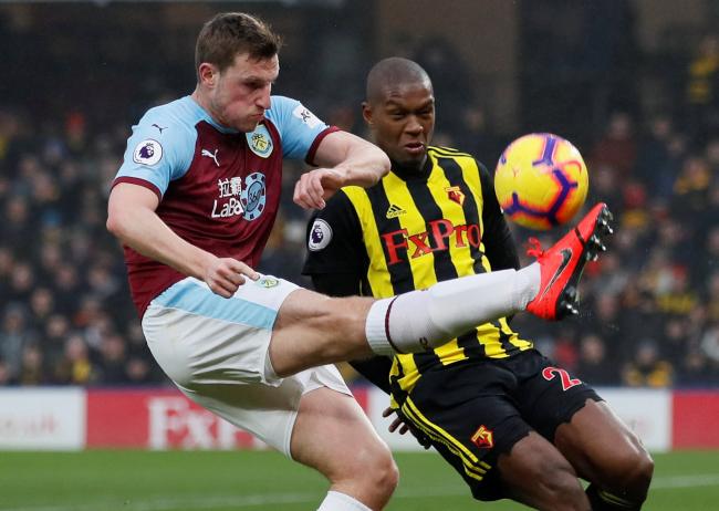 Chris Wood tries to hook the ball away from Christian Kabasele when Burnley faced the Hornets in 2019. Picture: Action Images