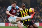 Chris Wood tries to hook the ball away from Christian Kabasele when Burnley faced the Hornets in 2019. Picture: Action Images